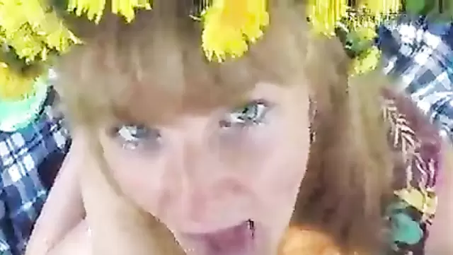 Russian babe gives a nice blowjob to a guy outdoors